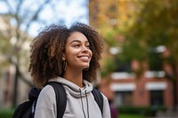 African american college student smile sky architecture. 