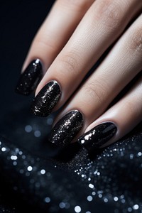 Black glitter nail polish, beauty photo. 