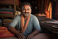 Indian happy Cloth merchant sitting adult smile. AI generated Image by rawpixel.
