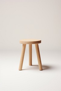 Simple wooden stool with three legs. Minimalist stool design. Wooden stool for seating. Light wood stool, perfect for decor. Versatile wooden stool.