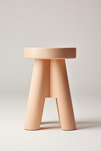 Minimalist wooden stool with a smooth finish. The stool features a simple, elegant design. Perfect for modern interiors, this stool adds a touch of natural style.