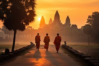 Outdoors walking temple monk. 