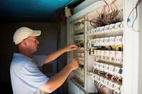 Electrical technician working adult man. 