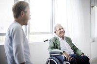 Senior man in wheelchair smiling. 