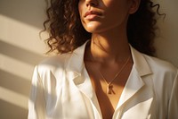 Gold minimal jewelry necklace sunlight white. AI generated Image by rawpixel.