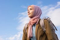 Teenager study abroad backpack looking scarf. 