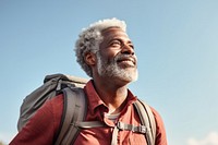 Senior man hiking portrait backpack looking. 