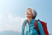 Senior woman hiking backpack looking adult. AI generated Image by rawpixel.