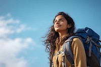 Indian woman hiking backpack looking blue. 