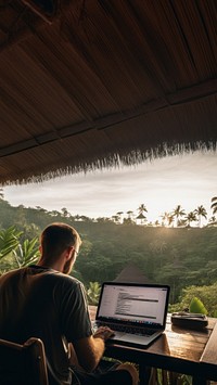 photo of man working from his laptop in bali.  