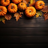 a top view photo of Pumpkins and maple leaves. 