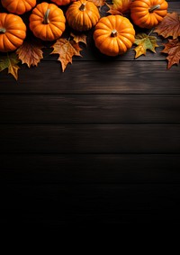 a top view photo of Pumpkins and maple leaves. 