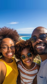 African Family selfie overlooking over the sea. 