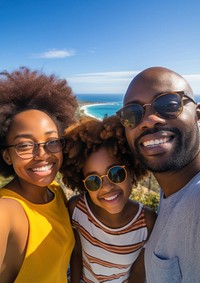 African Family selfie overlooking over the sea. 