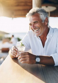 Close up photo of a middle-age men wearing white linen shirt. 