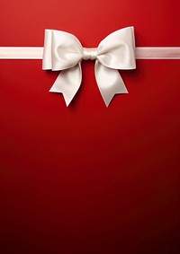 close up photo of a big white bow on gift box. 