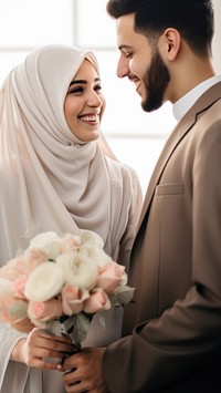 Cropped shot of muslim couple newlywed looking at each other, happy. AI generated Image by rawpixel.