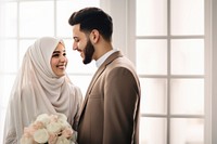 Cropped shot of muslim couple newlywed looking at each other, happy. 