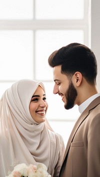 Cropped shot of muslim couple newlywed looking at each other, happy. 