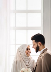 Cropped shot of muslim couple newlywed looking at each other, happy. 