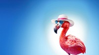 Flamingo wearing summer hat wearing sunglasses. 