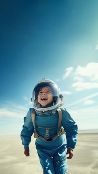 photo of smiling girl child dressed as astronaut.  