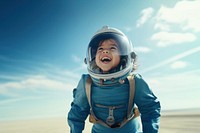 photo of smiling girl child dressed as astronaut.  