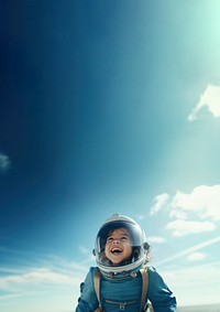 photo of smiling girl child dressed as astronaut.  