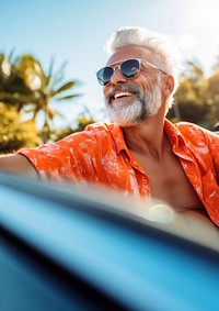 Photo of Happy senior man enjoying summer road trip, luxury cabriolet adventure.