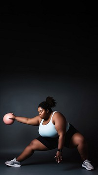 Photo of plus size woman doing fitness.  