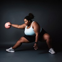 Photo of plus size woman doing fitness.  