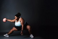 Photo of plus size woman doing fitness.  