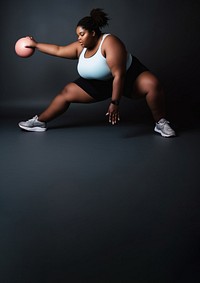 Photo of plus size woman doing fitness.  