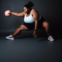 Photo of plus size woman doing fitness.  