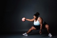 photo of plus size woman doing fitness.  