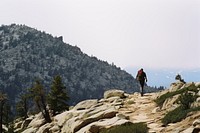 Man hiking recreation adventure mountain.