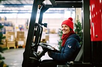 Woman driving forklift, industry photo. .