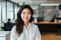 Happy japanese woman smiling standing portrait office. 