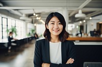 Happy japanese woman smiling standing portrait office. 