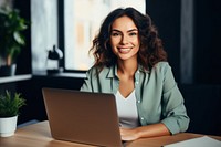 Nice woman using laptop computer sitting typing. 