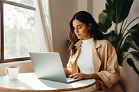 Young latina woman computer laptop sitting. 