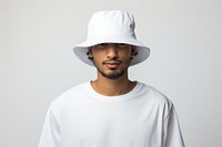 A man wearing white blank bucket hat t-shirt adult white background. AI generated Image by rawpixel.
