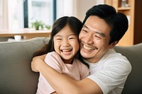 Daughter hugging happy father cheerful laughing toddler. 