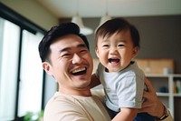 Son hugging happy father cheerful laughing toddler. 