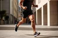 Fit man running shorts exercising. 