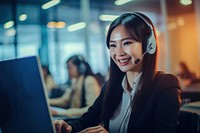 Asian women working laptop headphones computer. 