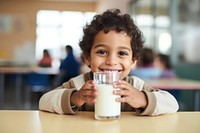Kid drinking milk carton refreshment milkshake happiness. AI generated Image by rawpixel.