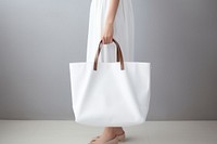 Women wearing white tote bag handbag accessories accessory. 