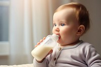 Baby bottle drinking milk refreshment. 