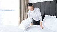 Hotel staff making bed. AI generated Image by rawpixel.